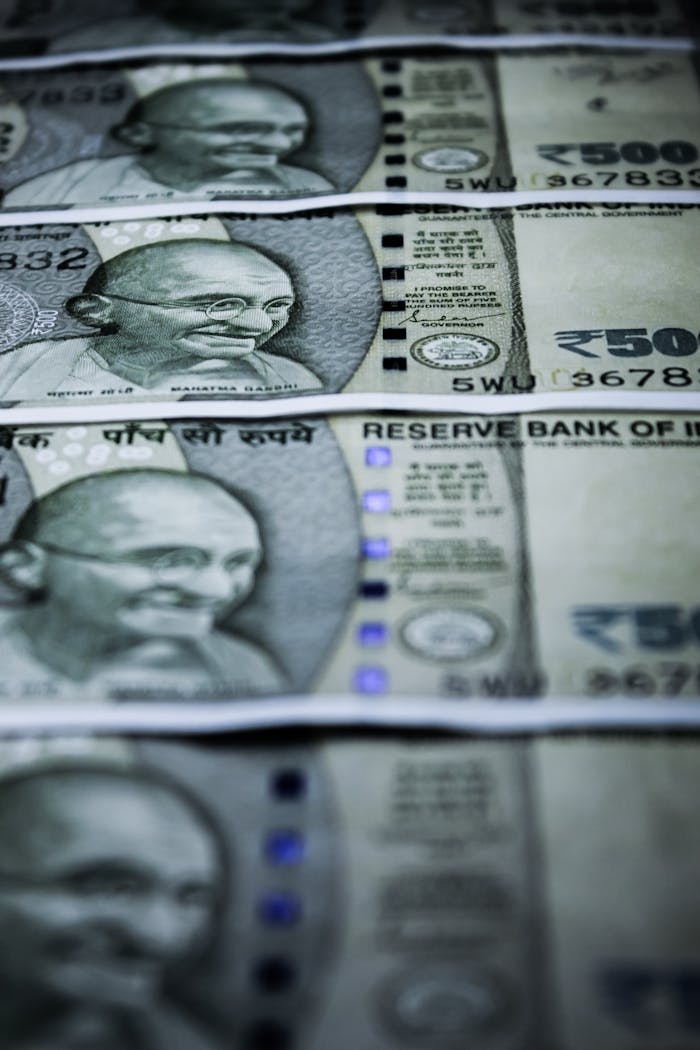 Close-up of Indian 500 rupee banknotes featuring Gandhi's portrait. Selective focus.